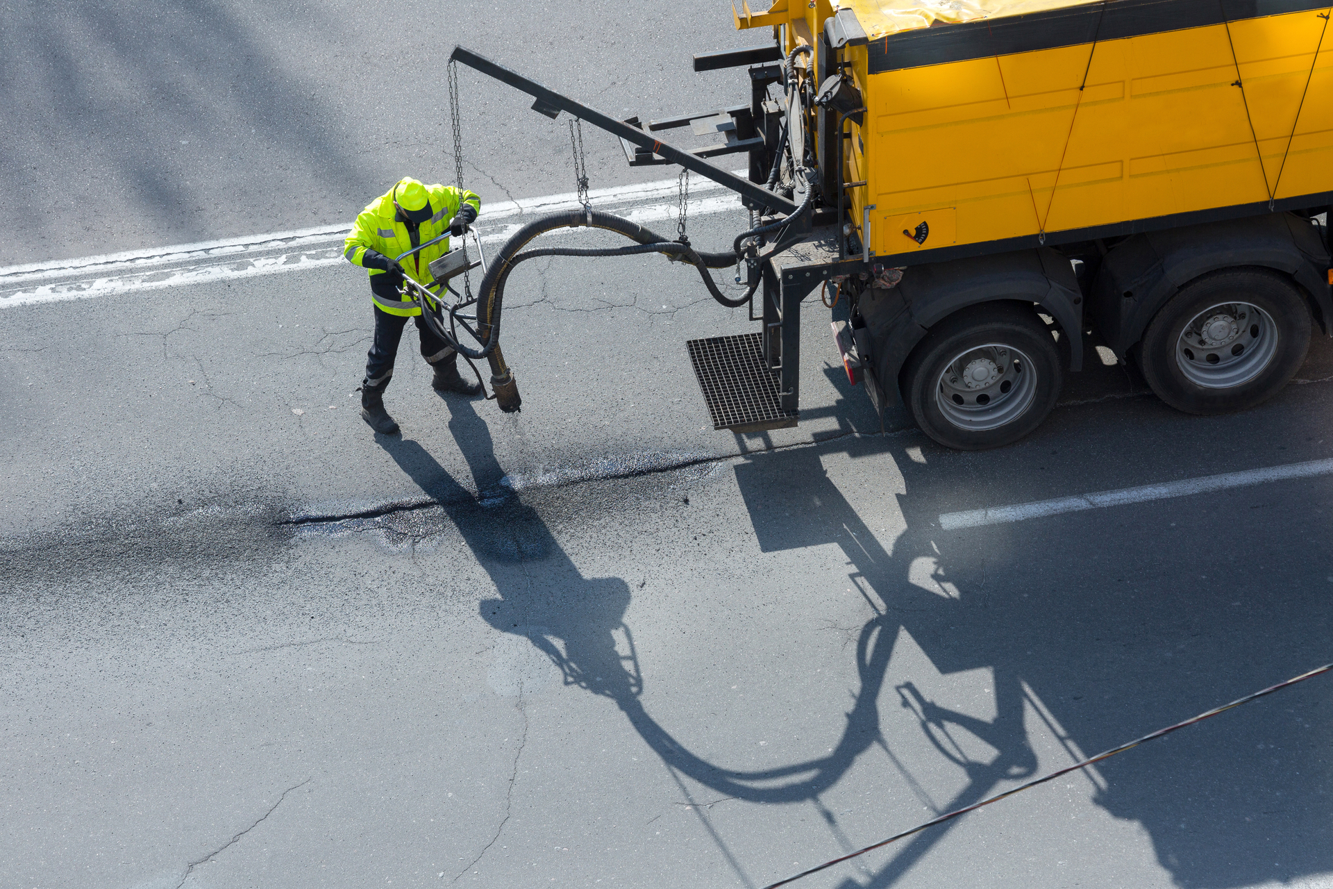 Road,Surface,Restoration,Work.,The,Worker,Performs,On,Road,Patcher